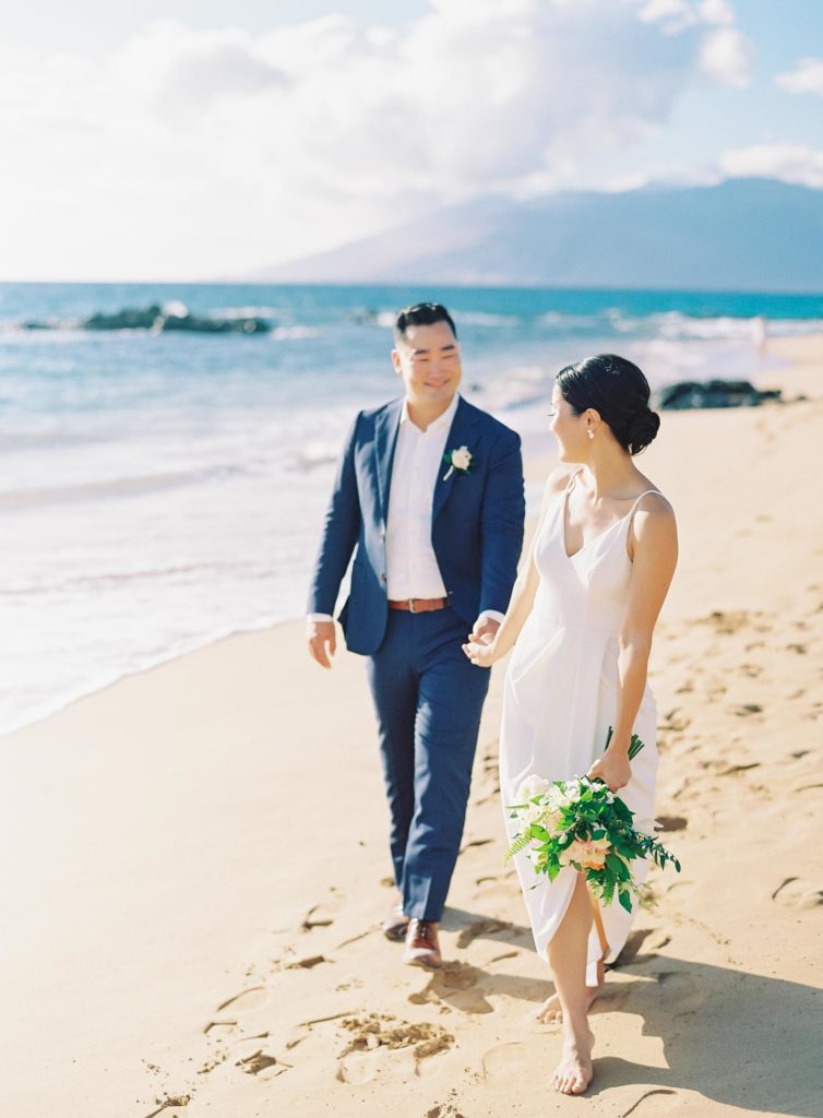 bride-and-groom-walk-on-beach-wailea-maui